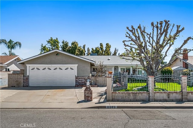 9945 Date St, Fontana, CA 92335 - single story home with a garage, driveway, and stucco siding