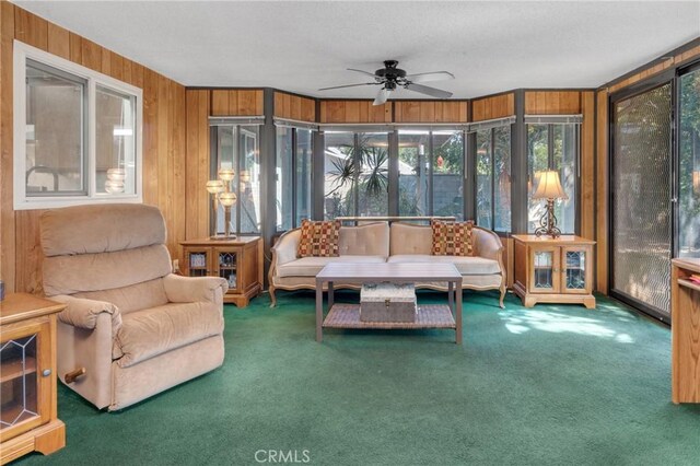 9945 Date St, Fontana, CA 92335 - sunroom / solarium featuring carpet floors and wood walls