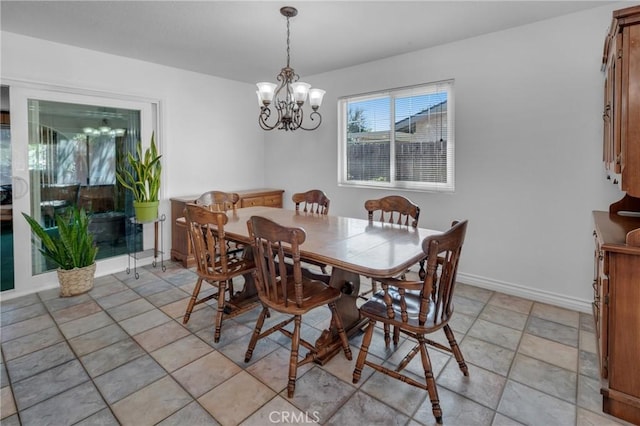 9945 Date St, Fontana, CA 92335 - dining area featuring a chandelier and baseboards
