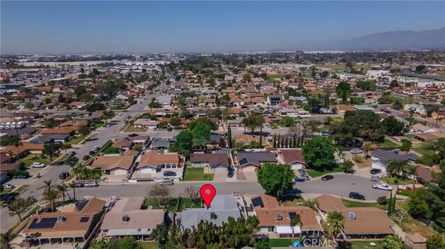 9945 Date St, Fontana, CA 92335 - aerial view of property and surrounding area featuring nearby suburban area and a mountain backdrop
