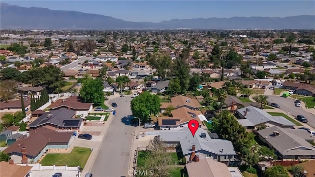 9945 Date St, Fontana, CA 92335 - aerial view of property and surrounding area with a mountainous background and nearby suburban area