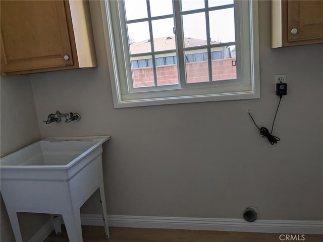 12707 Hoback St, Norwalk, CA 90650 - laundry room featuring cabinet space, baseboards, washer hookup, and hookup for an electric dryer