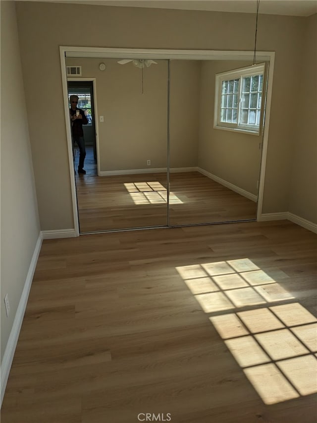 12707 Hoback St, Norwalk, CA 90650 - unfurnished bedroom featuring a closet, wood finished floors, and baseboards