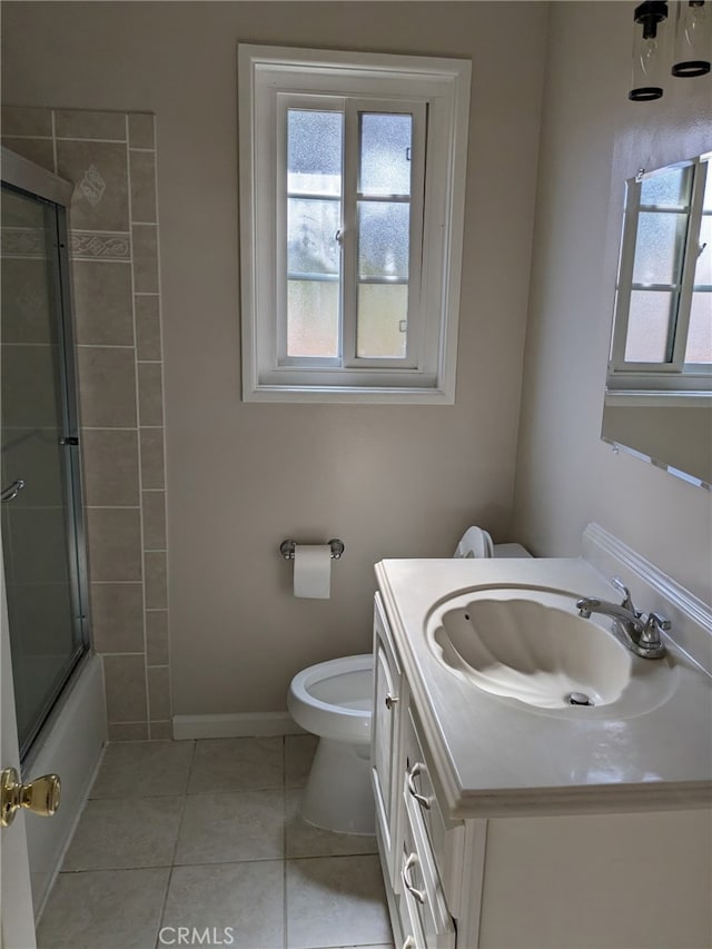 12707 Hoback St, Norwalk, CA 90650 - bathroom featuring toilet, tile patterned flooring, vanity, and bath / shower combo with glass door