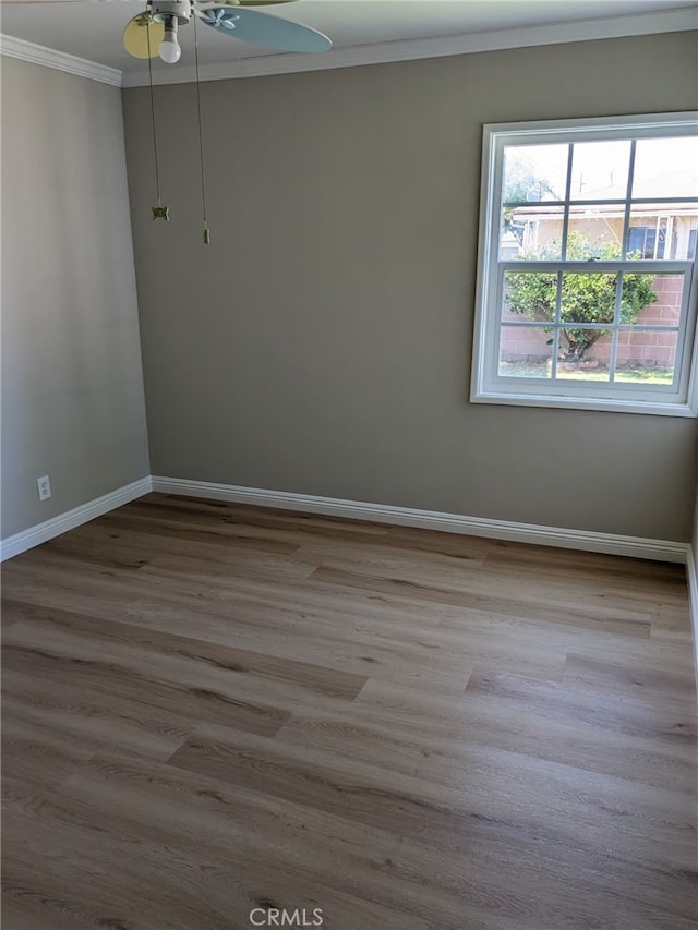 12707 Hoback St, Norwalk, CA 90650 - spare room with ornamental molding, baseboards, wood finished floors, and ceiling fan