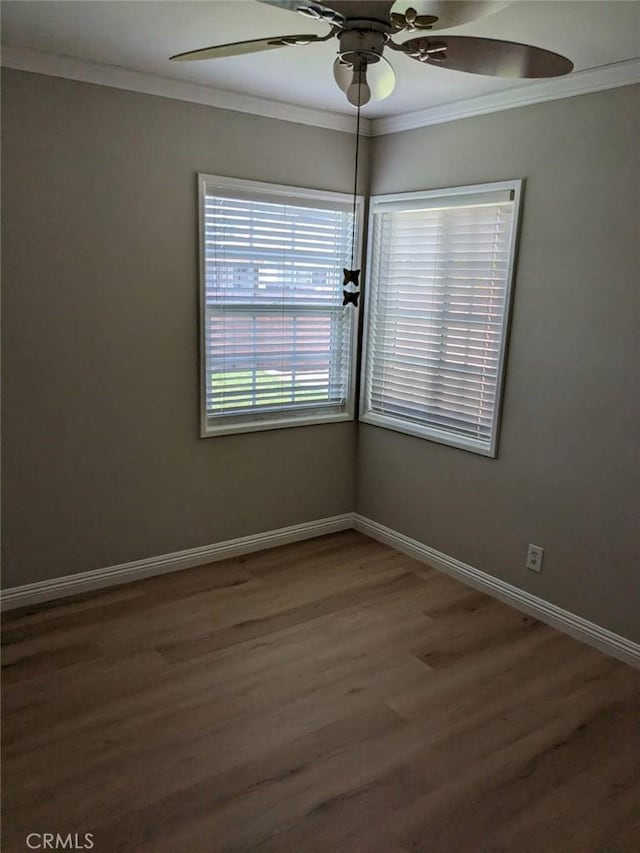 12707 Hoback St, Norwalk, CA 90650 - empty room featuring crown molding, ceiling fan, wood finished floors, and baseboards