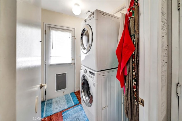 42635 56th St W, Lancaster, CA 93536 - laundry room with stacked washer and clothes dryer and heating unit