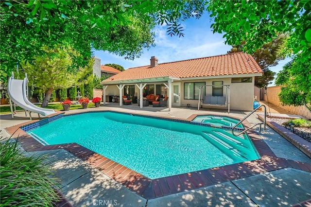 42635 56th St W, Lancaster, CA 93536 - view of pool featuring an in-ground hot tub, a water slide, outdoor lounge area, and a patio area