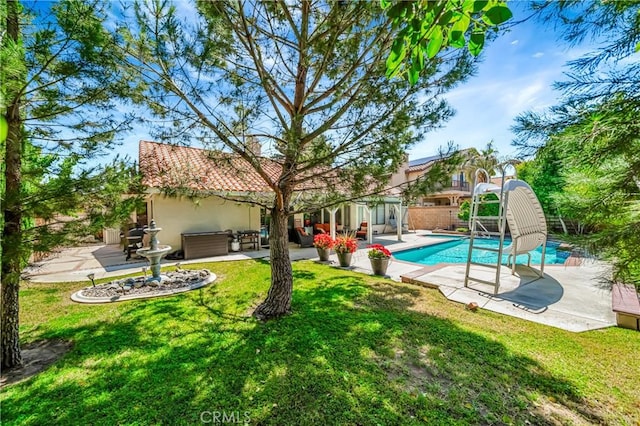 42635 56th St W, Lancaster, CA 93536 - view of swimming pool featuring a patio area, a water slide, and an outdoor hangout area