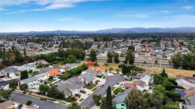 15061 Glass Cir, Irvine, CA 92604 - aerial view of property and surrounding area featuring a mountainous background and nearby suburban area
