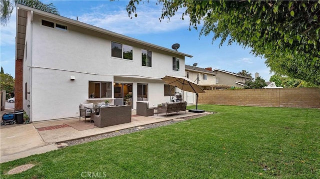 15061 Glass Cir, Irvine, CA 92604 - back of property with an outdoor hangout area, stucco siding, and a patio