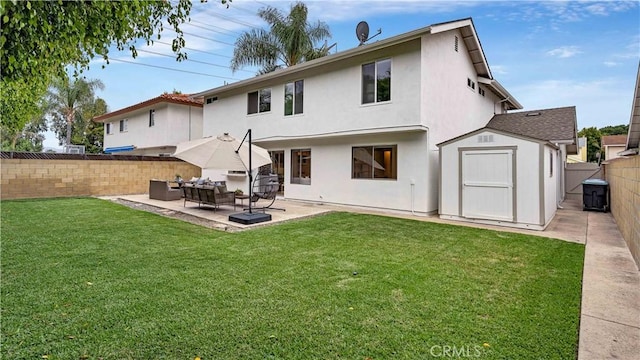 15061 Glass Cir, Irvine, CA 92604 - rear view of house featuring a fenced backyard, a storage unit, a patio area, stucco siding, and an outdoor hangout area