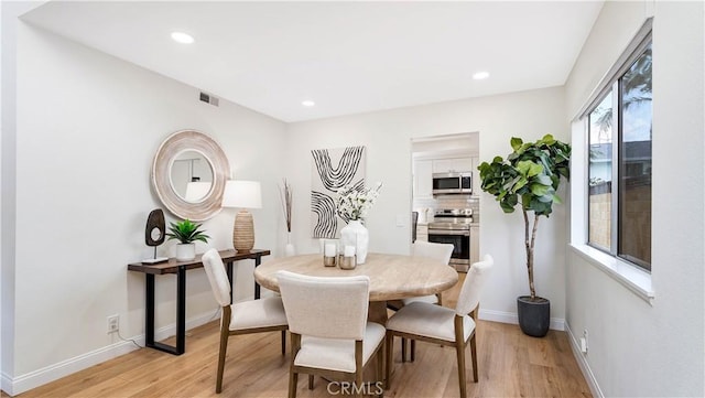 15061 Glass Cir, Irvine, CA 92604 - dining area with light wood finished floors and recessed lighting