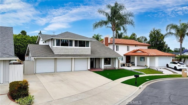15061 Glass Cir, Irvine, CA 92604 - view of front of house featuring concrete driveway, an attached garage, and roof with shingles