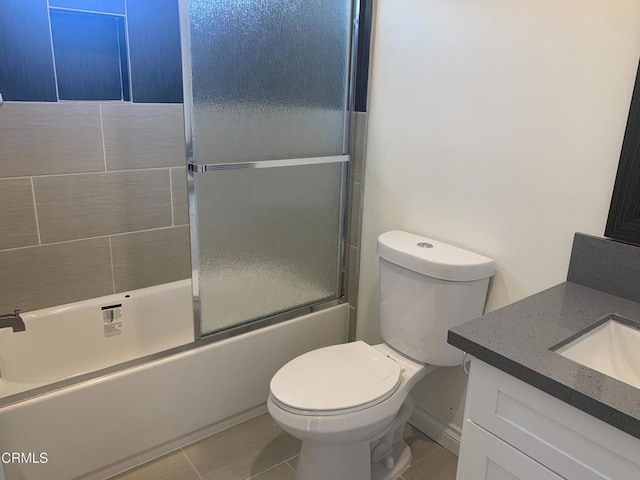 729 S Kern Ave, Los Angeles, CA 90022 - full bath with vanity, toilet, enclosed tub / shower combo, and tile patterned floors