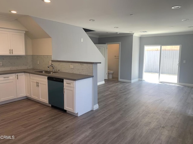 729 S Kern Ave, Los Angeles, CA 90022 - kitchen featuring dishwashing machine, a sink, dark countertops, white cabinets, and decorative backsplash