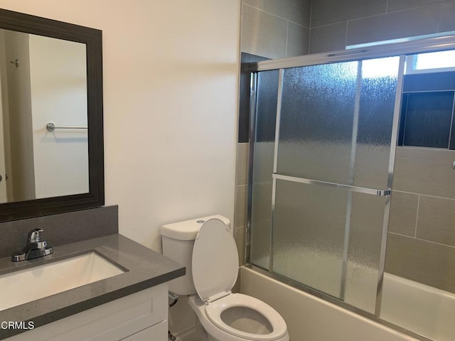 729 S Kern Ave, Los Angeles, CA 90022 - full bath with vanity, toilet, and shower / bath combination with glass door