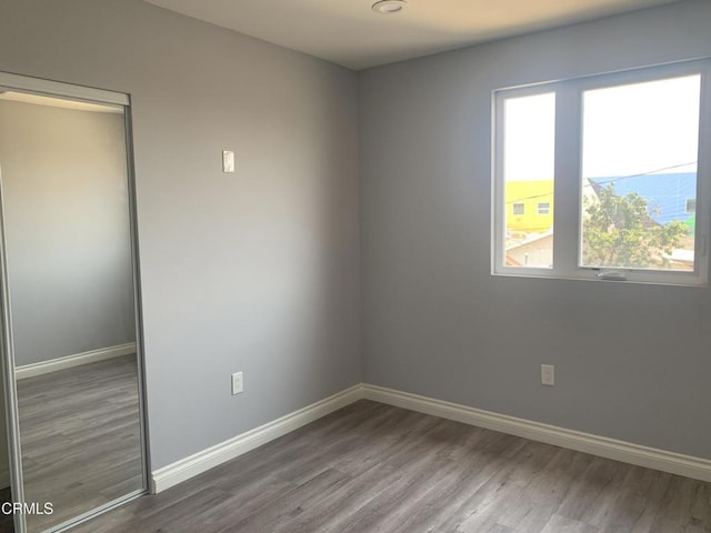 729 S Kern Ave, Los Angeles, CA 90022 - unfurnished room featuring wood finished floors and baseboards