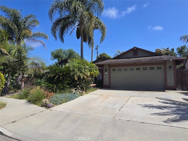 983 Oak St, Costa Mesa, CA 92627 - view of front facade featuring driveway and an attached garage