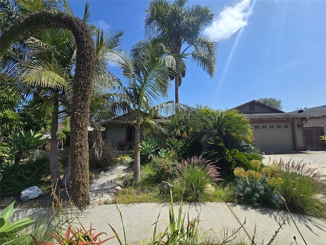983 Oak St, Costa Mesa, CA 92627 - view of front of house featuring concrete driveway and an attached garage