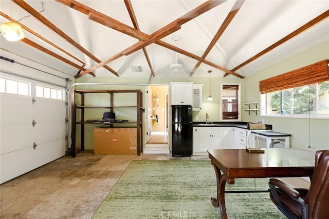 544 N California St, Burbank, CA 91505 - kitchen with freestanding refrigerator, dark countertops, white cabinetry, decorative light fixtures, and concrete flooring