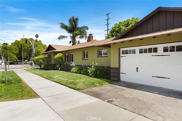 544 N California St, Burbank, CA 91505 - single story home with a front yard, a chimney, concrete driveway, a garage, and stucco siding
