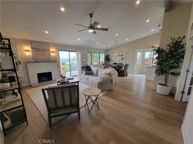 2722 Olympia Dr, Carlsbad, CA 92010 - living area with a ceiling fan, plenty of natural light, light wood finished floors, a tile fireplace, and recessed lighting