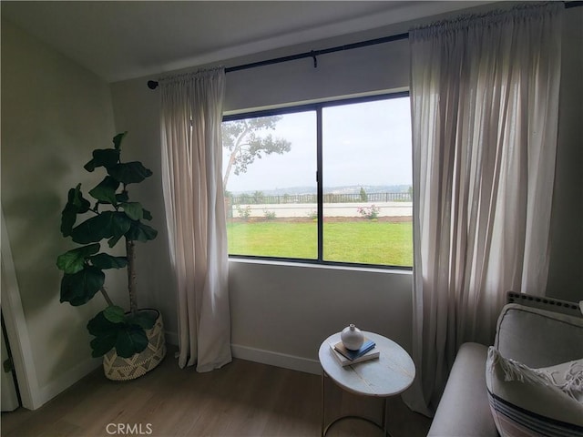 2722 Olympia Dr, Carlsbad, CA 92010 - living area featuring healthy amount of natural light and wood finished floors