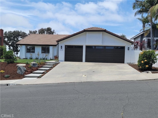 2722 Olympia Dr, Carlsbad, CA 92010 - view of front of property with an attached garage, a tiled roof, and driveway