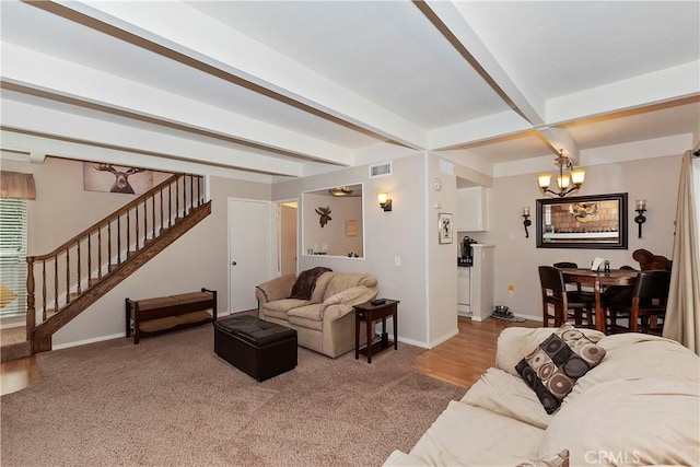 209 Cool Creek Ln Unit 10, Lake Arrowhead, CA 92352 - living area with a chandelier, stairs, baseboards, beamed ceiling, and carpet flooring