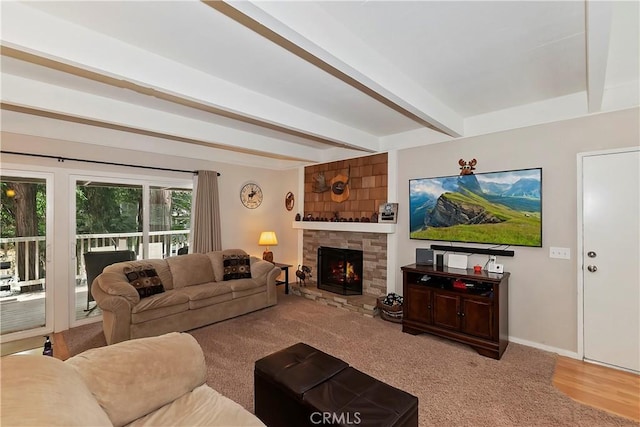 209 Cool Creek Ln Unit 10, Lake Arrowhead, CA 92352 - living room featuring beamed ceiling, a fireplace, baseboards, and carpet