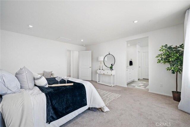 1330 Carolina Ct, Hemet, CA 92543 - bedroom featuring light colored carpet, recessed lighting, baseboards, and ensuite bath