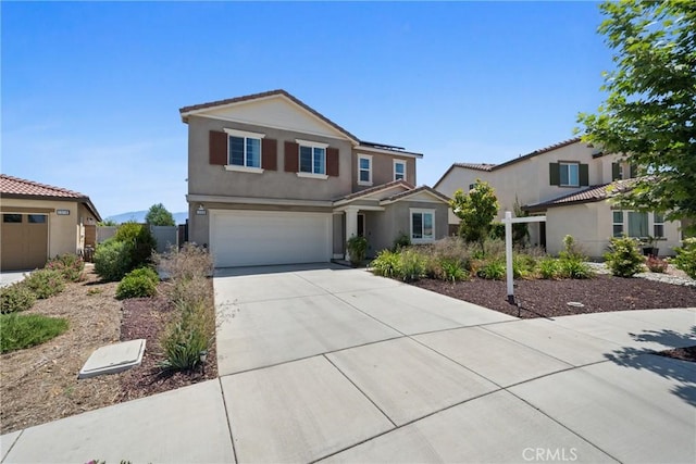 1330 Carolina Ct, Hemet, CA 92543 - traditional-style home featuring driveway, an attached garage, stucco siding, and solar panels