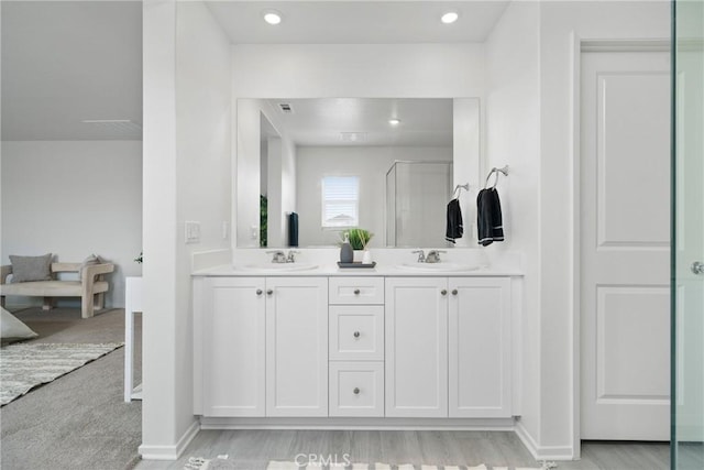 1330 Carolina Ct, Hemet, CA 92543 - bathroom featuring double vanity, an enclosed shower, recessed lighting, and baseboards