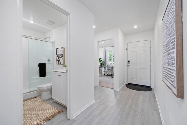 1330 Carolina Ct, Hemet, CA 92543 - foyer entrance featuring light wood-type flooring, baseboards, and recessed lighting