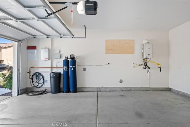 1330 Carolina Ct, Hemet, CA 92543 - garage featuring a garage door opener and tankless water heater