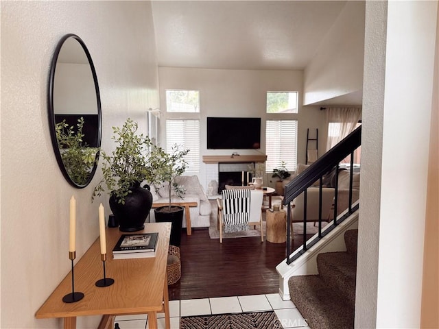 543 W Puente St Unit 3, Covina, CA 91722 - living area featuring stairway, tile patterned flooring, and a fireplace