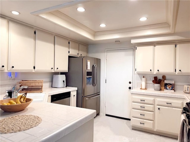 543 W Puente St Unit 3, Covina, CA 91722 - kitchen featuring a tray ceiling, a sink, stainless steel appliances, tile counters, and ornamental molding