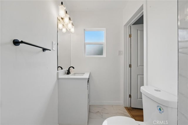 611 S Thorson Ave, Compton, CA 90221 - bathroom with toilet, marble finish flooring, vanity, and baseboards