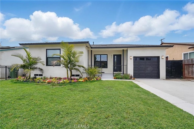 611 S Thorson Ave, Compton, CA 90221 - view of front of house with stucco siding, concrete driveway, and a garage