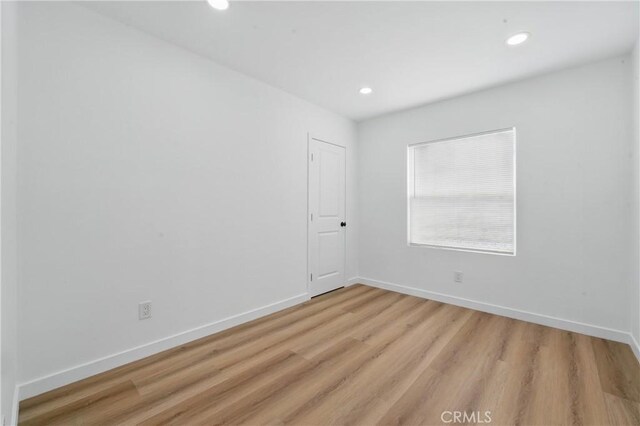 611 S Thorson Ave, Compton, CA 90221 - spare room with light wood-style flooring, recessed lighting, and baseboards