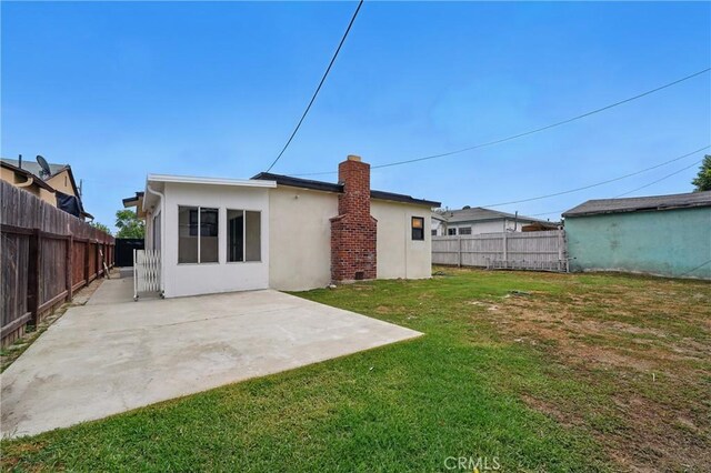 611 S Thorson Ave, Compton, CA 90221 - rear view of house with a patio area and stucco siding