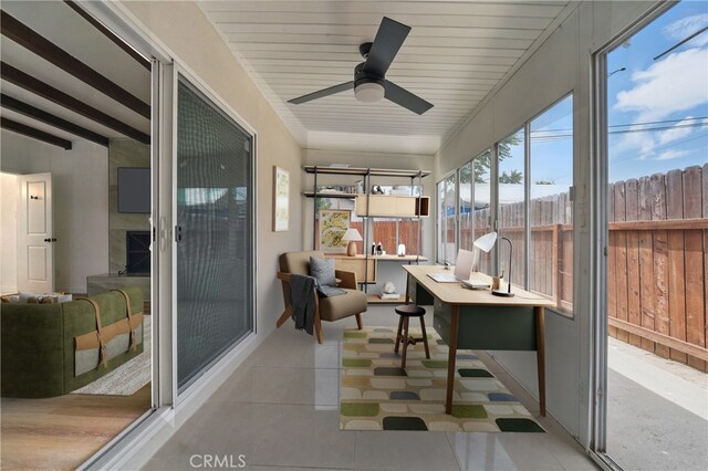 611 S Thorson Ave, Compton, CA 90221 - sunroom / solarium with healthy amount of natural light, tile patterned flooring, and ceiling fan