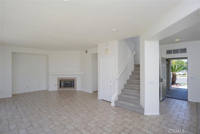 27292 Eagles Nest Dr, Corona, CA 92883 - unfurnished living room with stairs and a tile fireplace