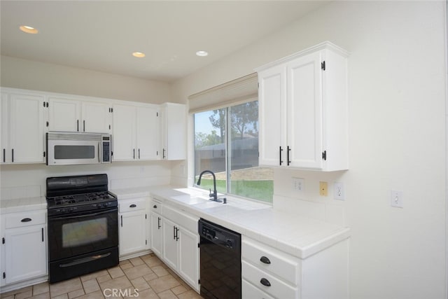 27292 Eagles Nest Dr, Corona, CA 92883 - kitchen featuring black appliances, tile counters, white cabinets, a sink, and recessed lighting