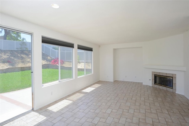 27292 Eagles Nest Dr, Corona, CA 92883 - unfurnished living room featuring healthy amount of natural light, a tile fireplace, and baseboards