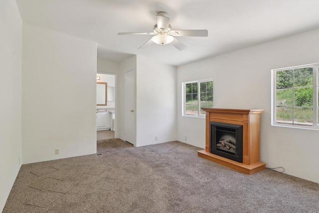34387 Wolahi Rd, Julian, CA 92036 - unfurnished living room featuring carpet floors, ceiling fan, and a fireplace with raised hearth