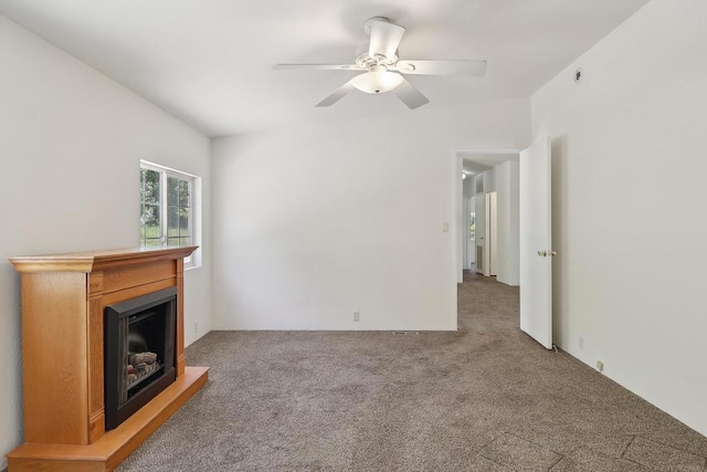 34387 Wolahi Rd, Julian, CA 92036 - unfurnished living room featuring carpet, ceiling fan, and a fireplace with raised hearth