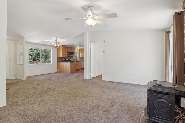 34387 Wolahi Rd, Julian, CA 92036 - unfurnished living room featuring light colored carpet, ceiling fan, and a chandelier