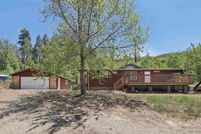34387 Wolahi Rd, Julian, CA 92036 - view of front of home with a wooden deck, a detached garage, and an outdoor structure